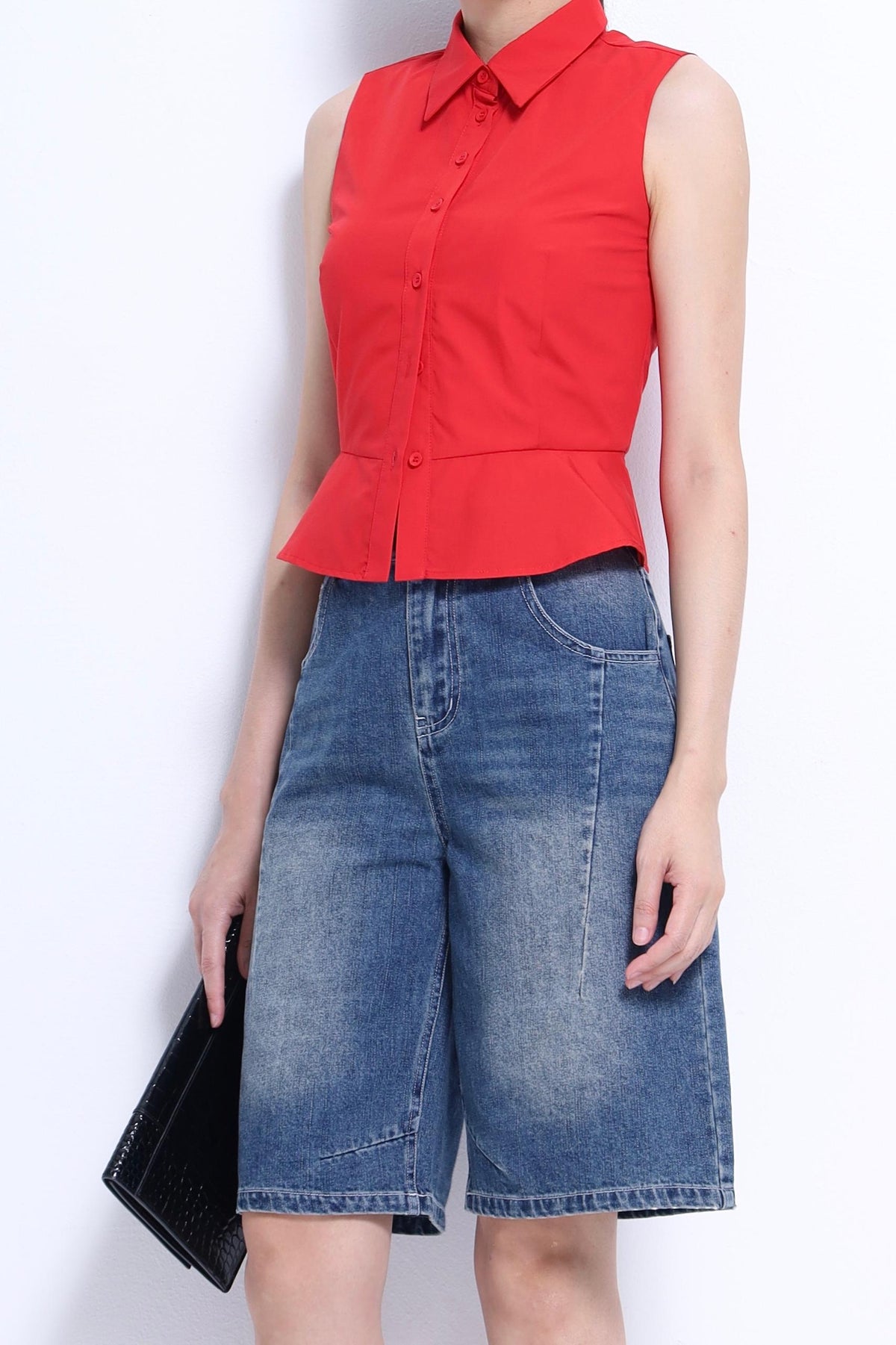Nim Sleeveless Peplum Shirt